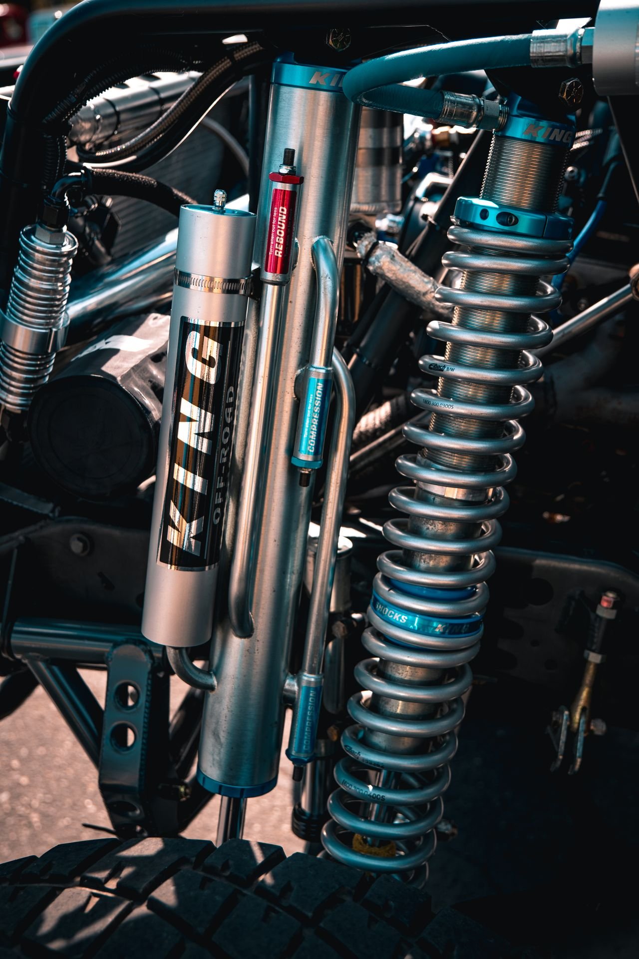 Close-up of a King Off-Road coilover with rebound and compression adjusters